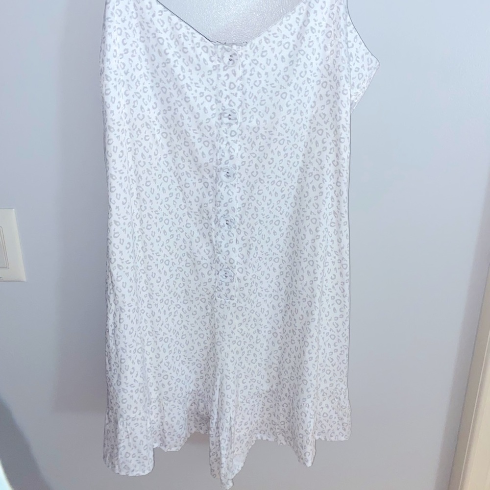 brand new white romper with grey cheetah print from “Dry Goods”